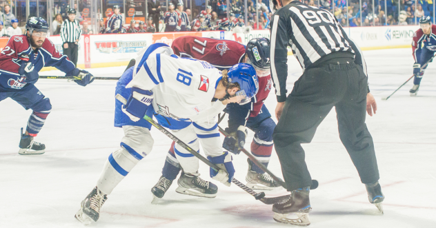 Wichita Thunder forward Carter Johnson (left) faces off with the Tulsa Oilers