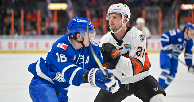 Wichita Thunder forward Carter Johnson (left) vs. the Kansas City Mavericks