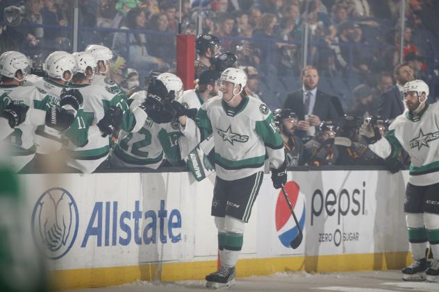 Texas Stars left wing Curtis McKenzie receives congratulations along the bench