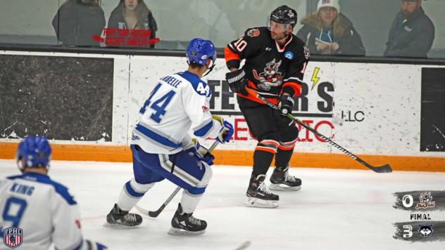 Danbury Hat Tricks forward Tom Mele (right) vs. the Watertown Wolves