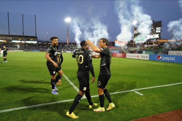 A post-goal celebration at an FC Tulsa match