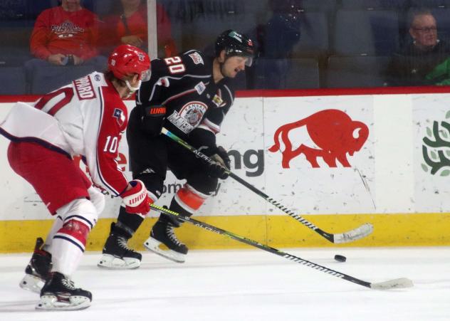 Allen Americans left wing Jackson Leppard (left) vs. the Kansas City Mavericks