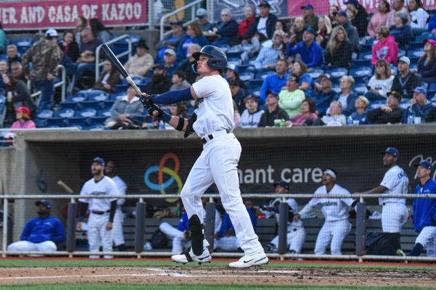 Griffin Conine of the Pensacola Blue Wahoos follows a blast in the season opener