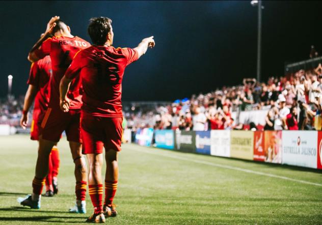 Phoenix Rising reacts to the crowd after a goal