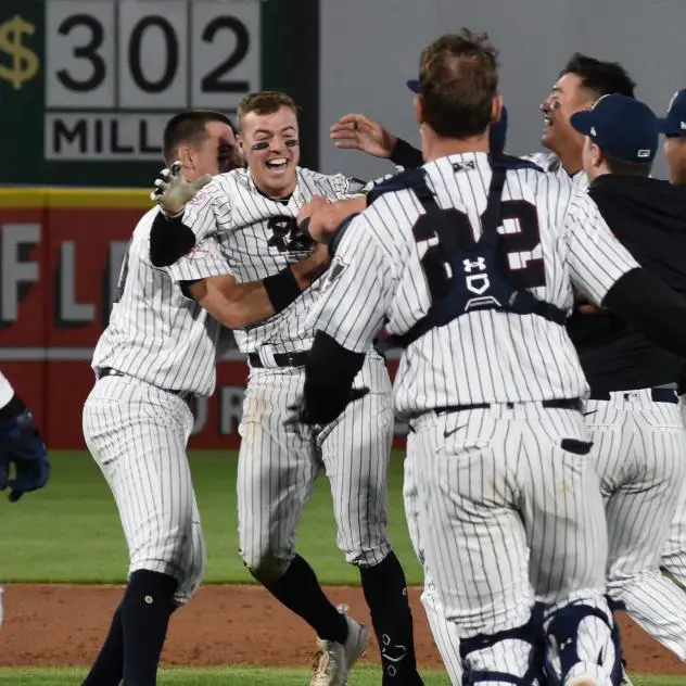 Brandon Lockridge and the Somerset Patriots celebrate a walk-off win
