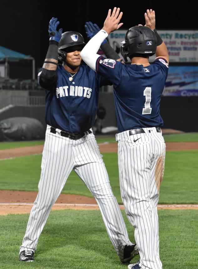 Somerset Patriots second baseman Jesus Bastidas (right) congratulates center fielder Jeisson Rosario