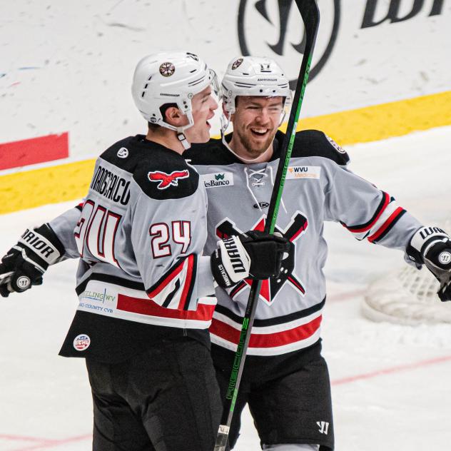Wheeling Nailers defenseman Josh Maniscalco (left) offers congratulations