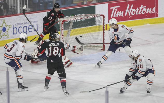 Jonny Hooker of the Prince George Cougars scores against the Kamloops Blazers