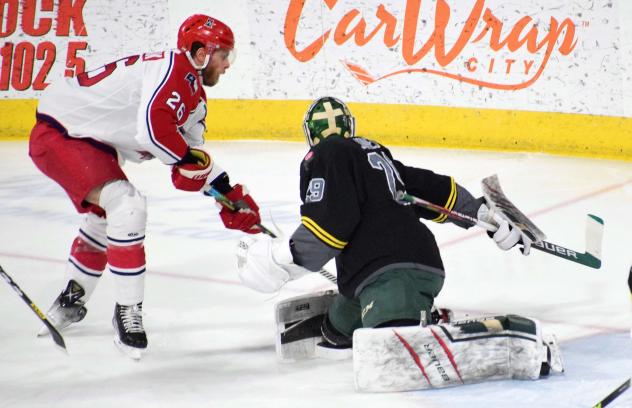 Spencer Asuchak of the Allen Americans (left) vs. the Iowa Heartlanders