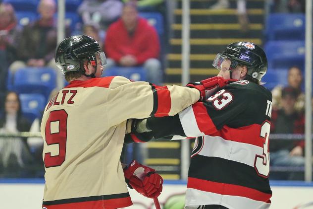 Belleville Senators defenseman Lassi Thomson (right) mixes it up with the Utica Comets