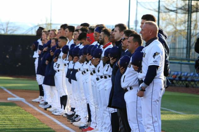 Tri-City Dust Devils line up for the National Anthem