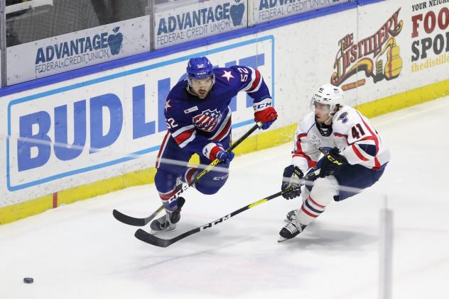 Springfield Thunderbirds right wing Will Bitten (right) vs. the Rochester Americans