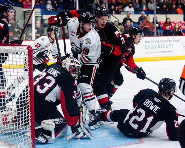 Prince George Cougars defend against the Portland Winterhawks