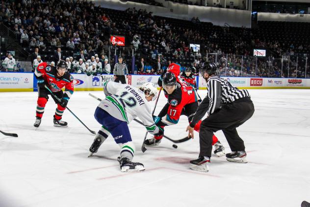 Kelowna Rockets centre Colton Dach (right) faces off with the Seattle Thunderbirds