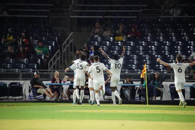 Colorado Springs Switchbacks FC react to the crowd after a goal against FC Tulsa