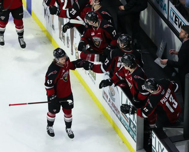 Vancouver Giants defenceman Mazden Leslie along the Giants bench