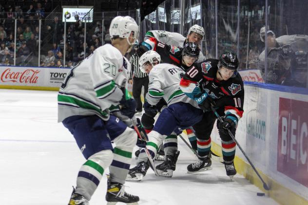 Kelowna Rockets left wing Turner McMillan controls a puck along the boards vs. the Seattle Thunderbirds