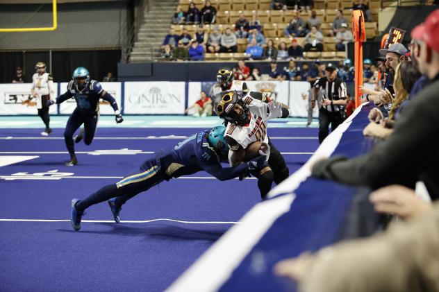 Massachusetts Pirates make a tackle against the Iowa Barnstormers