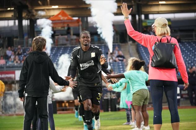 FC Tulsa defender Lebo Moloto enters the pitch