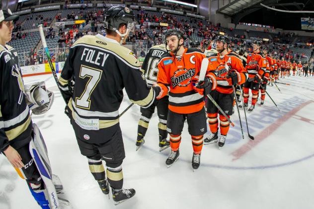 Wheeling Nailers and Fort Wayne Komets shake hands as they exit the ice