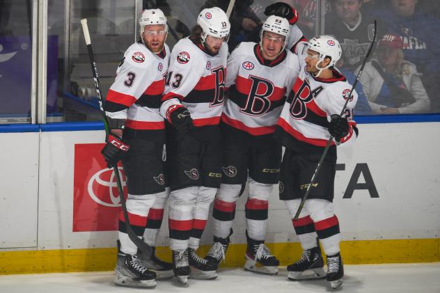 Belleville Senators gather after a goal