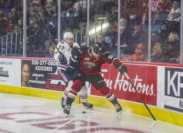 Vancouver Giants right wing Justin Lies (right) vs. Mats Lindgren of the Kamloops Blazers
