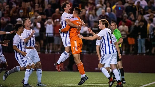 Louisville City FC rushes the field after advancing past Detroit City FC