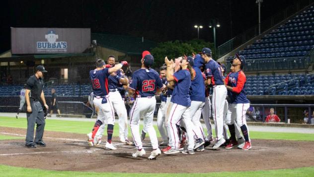 Rome Braves mob Landon Stephens following his walk-off home run