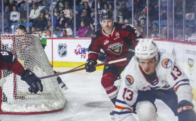 Vancouver Giants right wing Justin Lies (left) vs. the Kamloops Blazers