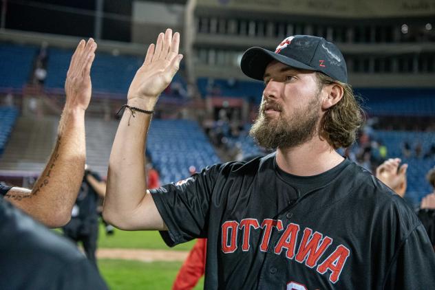 Ottawa Titans exchange high fives after a win against the Florence Y'alls