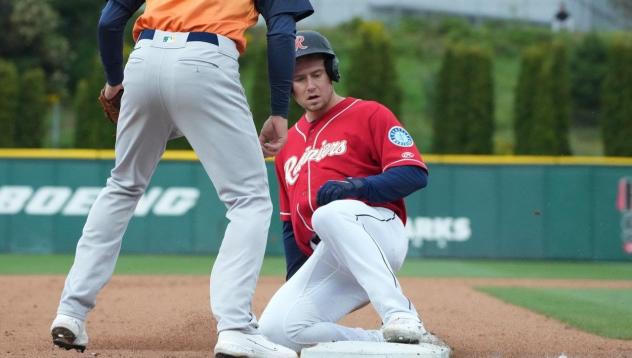 Jarred Kelenic of the Tacoma Rainiers slides safely into third