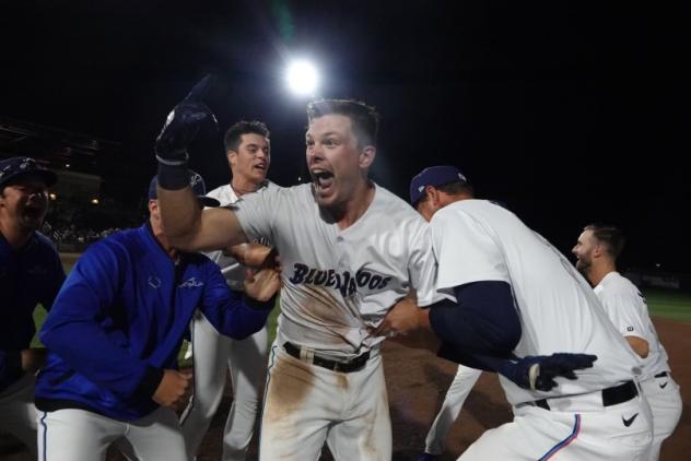 Troy Johnston and the Pensacola Blue Wahoos celebrate a walk-off win
