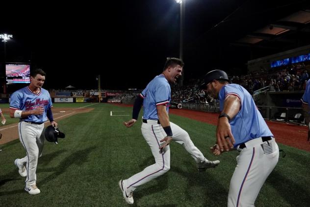 Pensacola Blue Wahoos celebrate a walk-off win