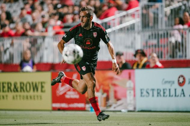 Phoenix Rising FC eyes the ball against El Paso Locomotive FC
