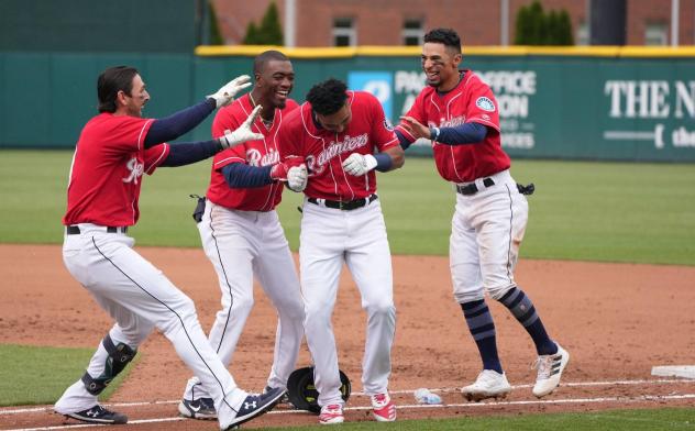 Tacoma Rainiers mob Erick Mejia after their walk-off win