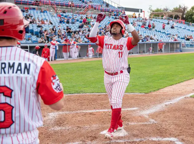 Ottawa Titans outfielder Rodrigo Orozco touches home