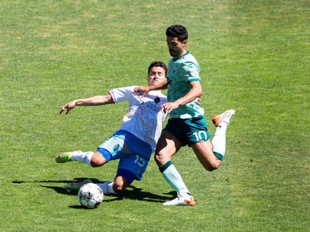 Las Vegas Lights FC midfielder Daniel Crisostomo slides in against San Diego Loyal SC