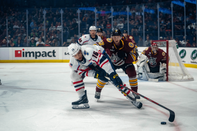 Springfield Thunderbirds center Dakota Joshua reaches for the puck against the Chicago Wolves