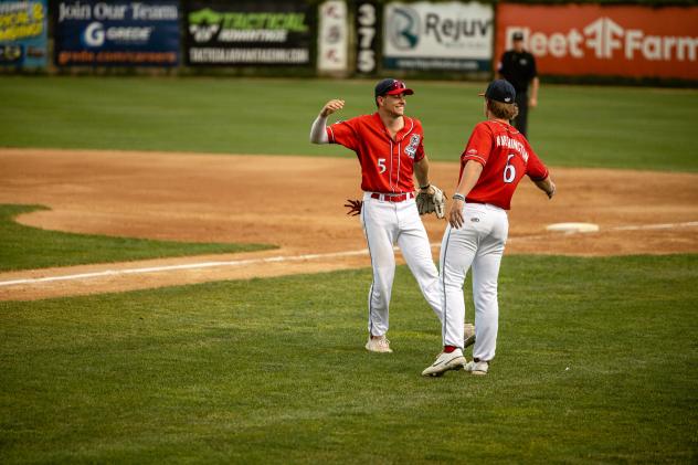 Ethan Mann of the St. Cloud Rox receives congratulations