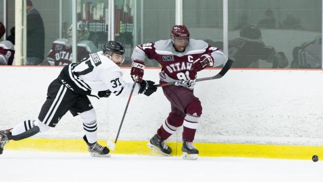 Yvan Mongo (Right) skating for the University of Ottawa