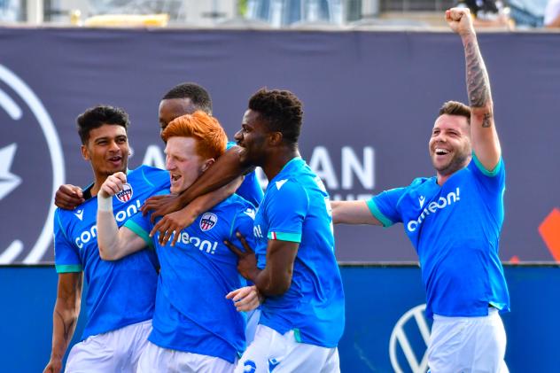 Atlético Ottawa celebrates Ollie Bassett's goal against Forge FC