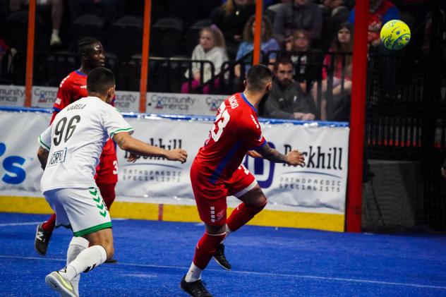 Midfielder Julio Varela with the Dallas Sidekicks (left)