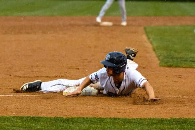 Trevor Austin of the St. Cloud Rox slides safely into third