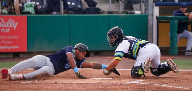 Everett AquaSox catch Ty Duvall applies the tag against the Hillsboro Hops