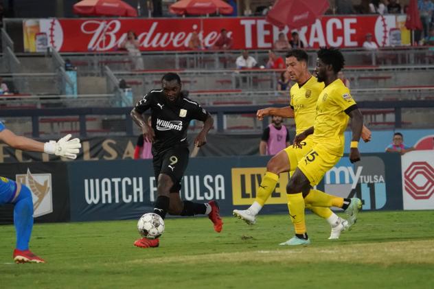 FC Tulsa forward Brian Brown (left)