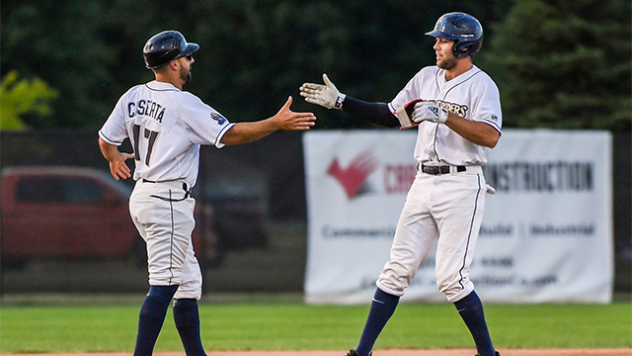 Hitting Coach Tyler Caserta congratulates Andrew Sojka of the Fond du Lac Dock Spiders