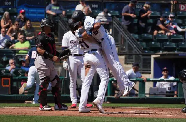 Tacoma Rainiers' Brian Erick Mejia congratulates Mason McCoy