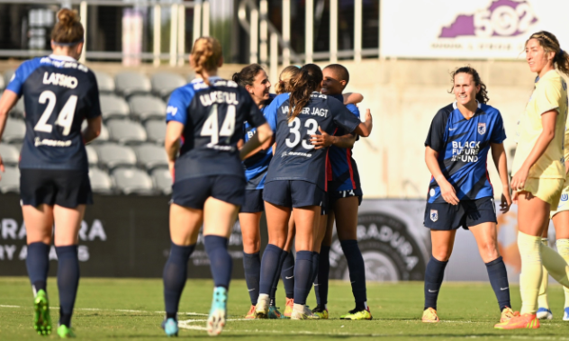 OL Reign celebrates a goal