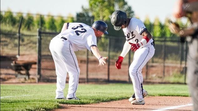Northern Colorado Owlz exchange a low five