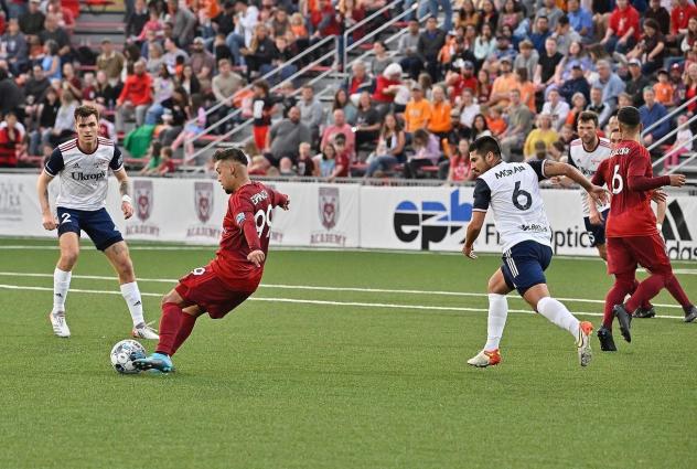 Chattanooga Red Wolves midfielder Moe Espinoza with possession